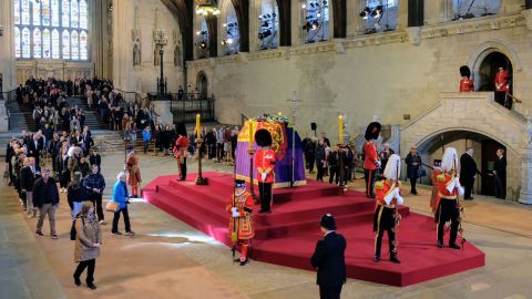 Mourners pay their respects as they file past the Queen's coffin inside Westminster Hall.