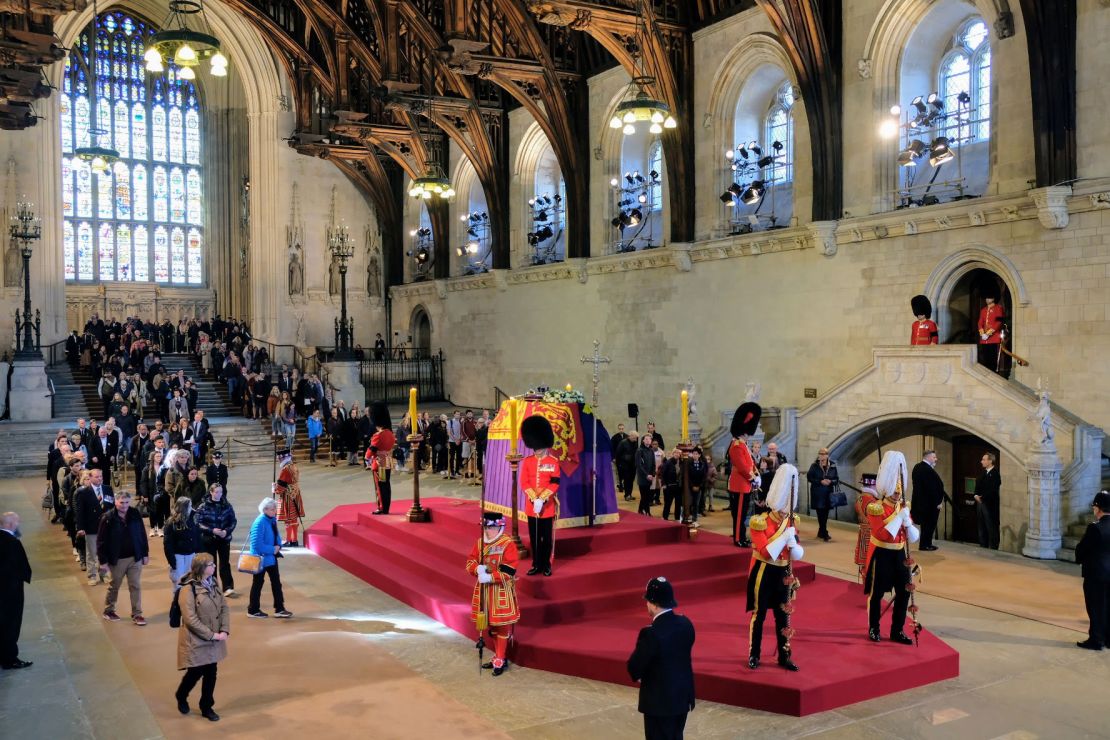 Mourners pay their respects as they file past the Queen's coffin inside Westminster Hall.
