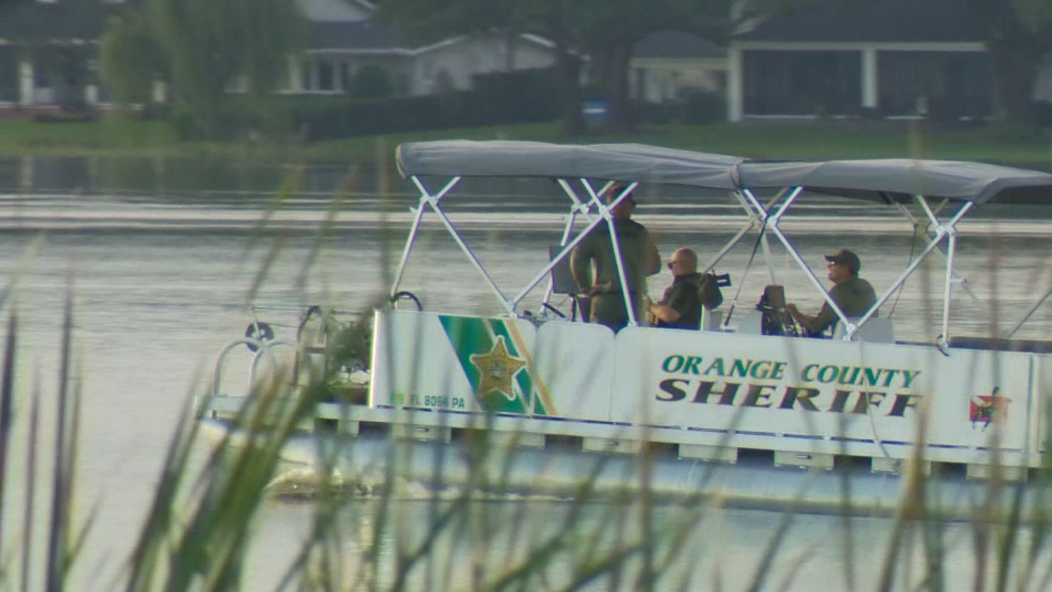 Orange County Sheriff deputies are seen on Lake Fairview in Orlando, Florida.