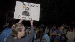 Survivors of sexual violence, advocates, and students united at a rally organized by former Michigan Football player, Jonathon Vaughn in Ann Arbor, MI on October 13, 2021, moving many to tears. Nearly one hundred people gathered outside the residence of University of Michigan President, Mark Schlissel, demanding accountability from the university for the harm and trauma committed over several decades (1966-2003) by former University of Michigan Athletic Doctor, Robert Anderson. Over 950 survivors have come forward with allegations of Anderson assaulting them during exams, making the current legal suit against the university one of the largest in U.S. history. (Photo by Adam J. Dewey/NurPhoto via AP)