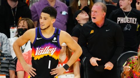 Robert Sarver alongside the Suns' star guard Devin Booker.