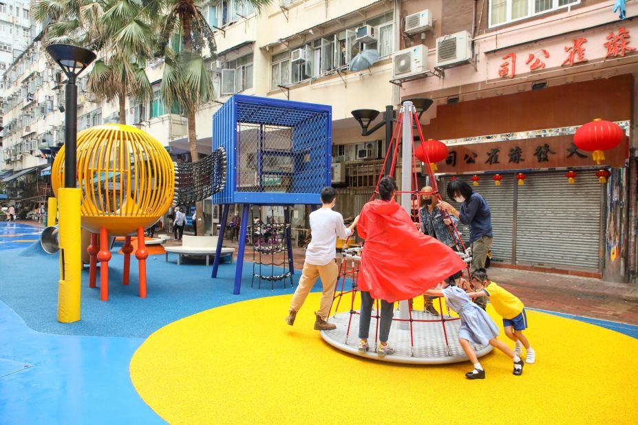 The park includes play areas for children, exercise zones for the elderly, and benches for families and friends to socialize.