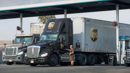 A UPS truck driver locks his vehicle at a truck stop near Interstate 5 on October 29, 2021, in Kettleman City, California. The recent record-breaking rain and snow in northern California has slowed the fire season but the state is still experiencing one of the driest and hottest periods of weather in recorded history, forcing municipalities and farmers in the Central Valley to rethink their uses of water. Governor Gavin Newsom recently declared a water "State of Emergency" for all of the counties and continues to ask residents to reduce their use of water by 15%.  
