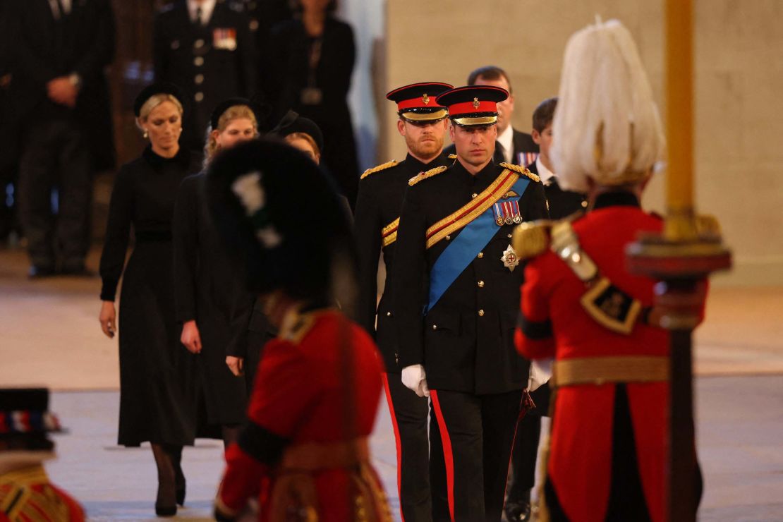 Prince William and the Queen's other grandchildren arrive to mount a vigil on Saturday. 
