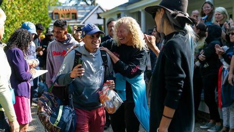 A Venezuelan migrant reacts as he is led onto a bus at St. Andrews Episcopal Church on Sept. 16, 2022, in Edgartown, Massachusetts, on the island of Martha's Vineyard.