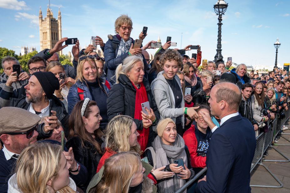 Prince William greets people waiting in line to see the Queen lying in state on Saturday.