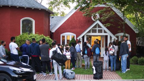 The migrants gather outside the church on Wednesday, the day they arrived on Martha's Vineyard. Juan Ramirez said he and the other migrants 