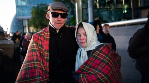 Richard and Emma Hawkins from Nottingham, UK in the queue at Tower Bridge, London, UK.
Emma: "It's so cold, absolutely freezing, it's historic, one minute we've been happy and the next it feels like never ending. I've never met the Queen but at the beginning of the year when I realised she didn't have long left, I so wanted to meet her and now she's gone. This is the last time you can be near her."
Richard: "Emma decided we were coming! It's cold but it's history."
The Queue to see the Queen lying in state in Westminster Hall, goes past Tower Bridge and on into Southwark Park. 17th September, 2022, London, UK.