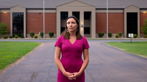 Christina Ellegood, 40, stands across the street from Heath High School.