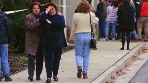 Parents gather outside Heath High School following the shooting.