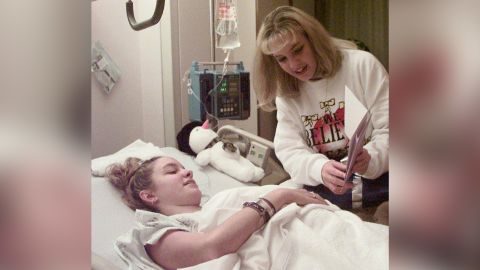 Miss Jenkins and her twin sister Mandy look at a recovery card at a Kentucky hospital in 1997.
