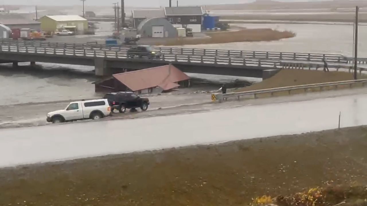 A building that was swept away from its foundation crashes into a road overpass in Nome, Alaska on Saturday Sept. 17, 2022. 