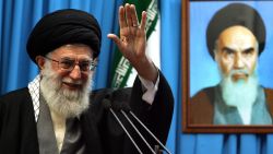 A handout photo provided by Iran's Supreme Leader's office shows Iranian supreme leader Ayatollah Ali Khamenei waving next to a portrait of Iran's late founder of Islamic Republic, Ayatollah Ruhollah Khomeini during Friday prayers sermon at Tehran University on February 3, 2012. Khamenei said that Iran has its "own threats" to respond to any military attack or sanctions against its oil exports. AFP PHOTO/HO/KHANENEI.IR   ++  RESTRICTED TO EDITORIAL USE - MANDATORY CREDIT "AFP PHOTO / KHAMENEI.IR" - NO MARKETING NO ADVERTISING CAMPAIGNS - DISTRIBUTED AS A SERVICE TO CLIENTS ++ (Photo by - / KHAMENEI IR / AFP) (Photo by -/KHAMENEI IR/AFP via Getty Images)