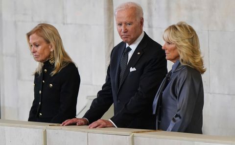 US President Joe Biden and first lady Jill Biden, right, view the Queen's coffin on Sunday. They were accompanied by Jane Hartley, the US ambassador to the United Kingdom.