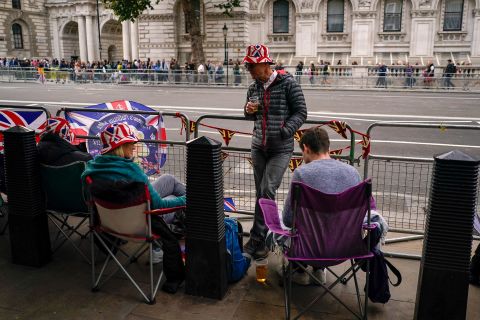 To get a spot ahead of the Queen's funeral procession on Monday, people camp out Sunday along Whitehall, a street that cuts through London's government district.