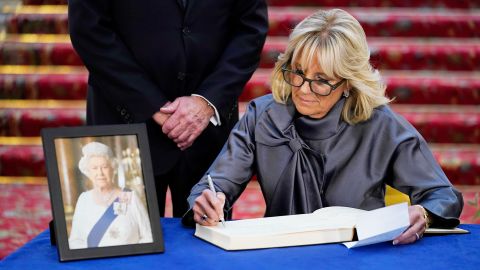 First lady Jill Biden sign a condolence book at Lancaster House in London.