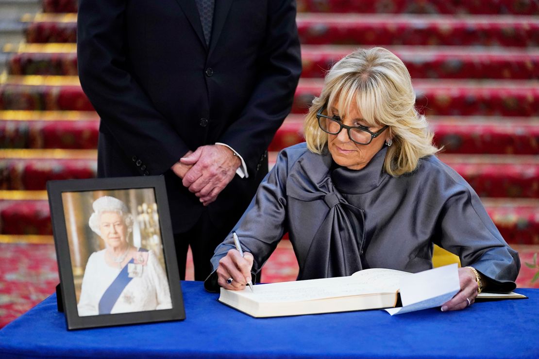 First lady Jill Biden sign a condolence book at Lancaster House in London.
