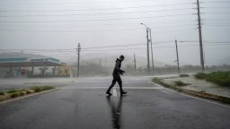 A man stands in the strong winds of Hurricane Fiona in Ponce, Puerto Rico September 18, 2022.  REUTERS/Ricardo Arduengo