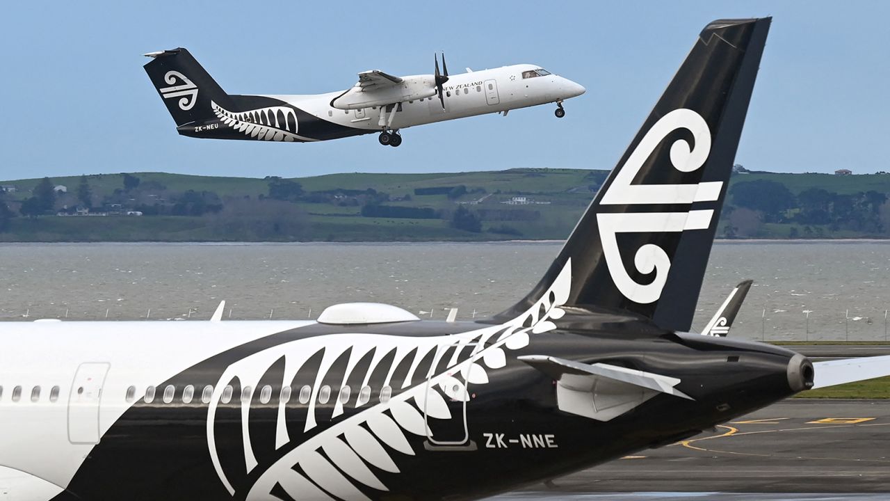 A photo taken on August 9, 2021 shows an Air New Zealand plane taking off from Auckland Airport with the national carrier managing to cut its losses by a third in the last financial year as strong domestic and cargo demand partially offset the impact of the global pandemic, the airline said August 26, 2021. (Photo by William WEST / AFP) (Photo by WILLIAM WEST/AFP via Getty Images)