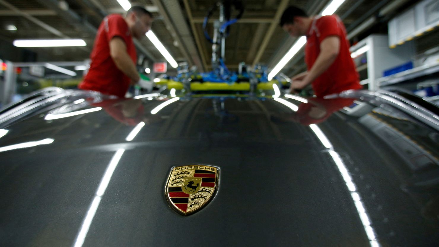  Employees of German car manufacturer Porsche install the windshield of a Porsche 911 at the Porsche factory in Stuttgart-Zuffenhausen, Germany, February 19, 2019.