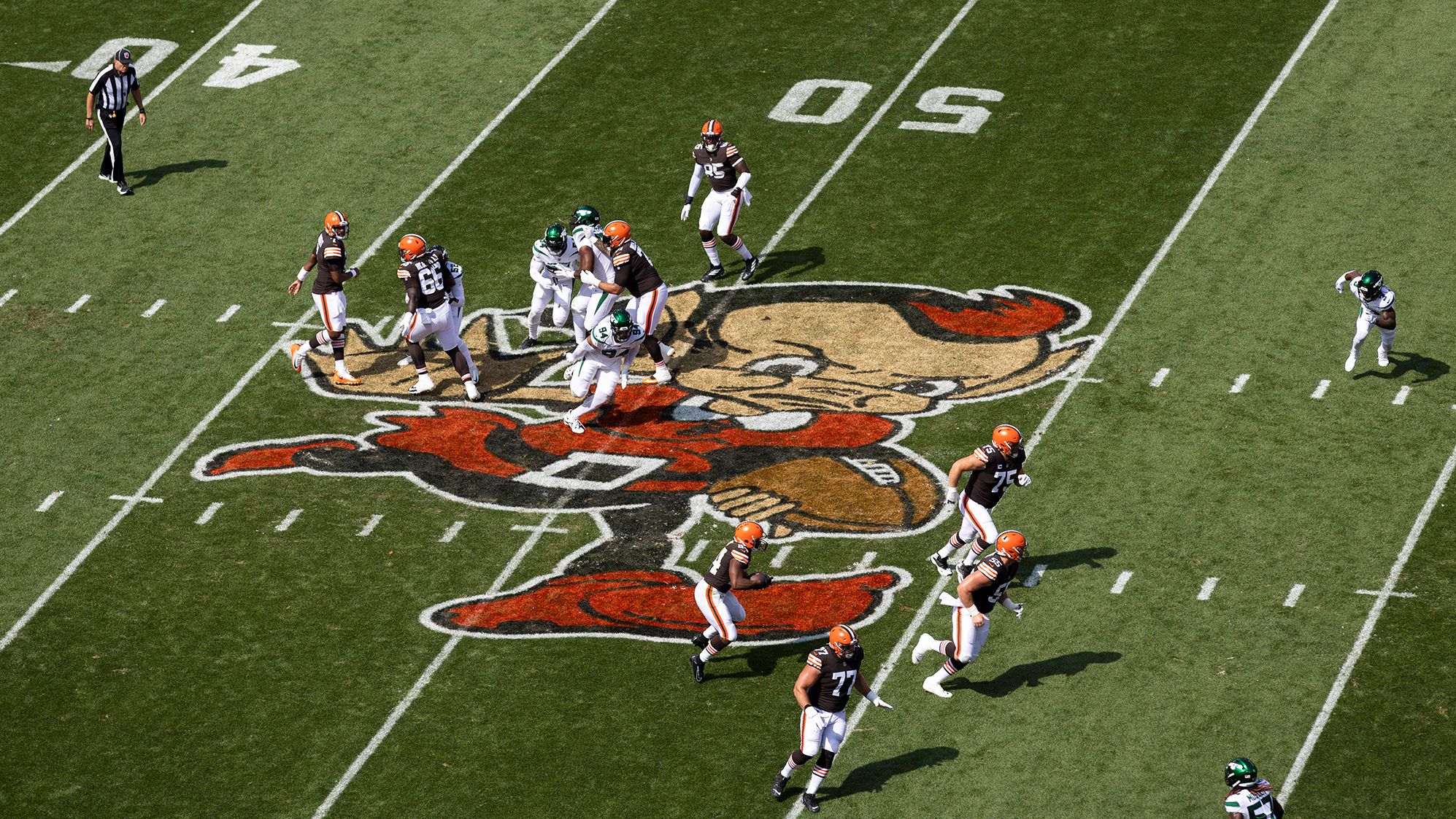 The Cleveland Browns run the ball across midfield against the New York Jets during the first quarter at FirstEnergy Stadium. The Browns ended up losing 31-30 after being up by 13 points with 1:55 remaining in the game. Jets QB Joe Flacco threw for 307 yards and four TDs — including two in the final two minutes of the game — to carry the Jets. Sunday's game saw the return of "Brownie the Elf" to the Browns' home field. The logo was initially used by the Browns in their inaugural season in 1946 but fell out of favor in the 60s, returning when the franchise was brought back to Cleveland in 1999.