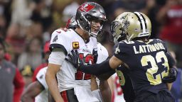 Tampa Bay Buccaneers wide receiver Mike Evans (13), quarterback Tom Brady (12) and New Orleans Saints cornerback Marshon Lattimore (23) get into an altercation during the second half of an NFL football game, Sunday, Sept. 18, 2021, in New Orleans. (AP Photo/Jonathan Bachman)