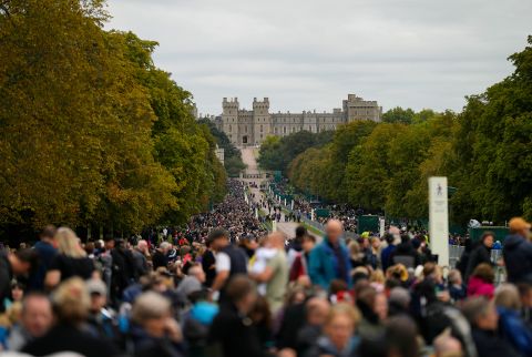 People stand outside Windsor Castle, where the Queen will be laid to rest.