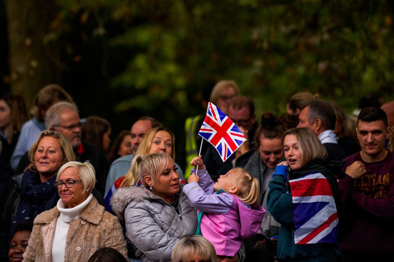People gather in central London before the start of the funeral.