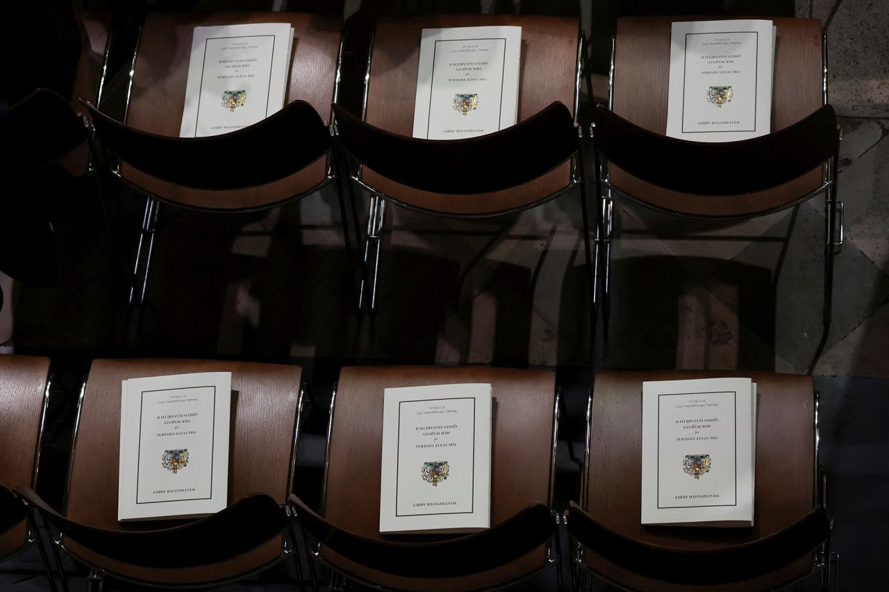 Funeral programs are left on chairs at Westminster Abbey.
