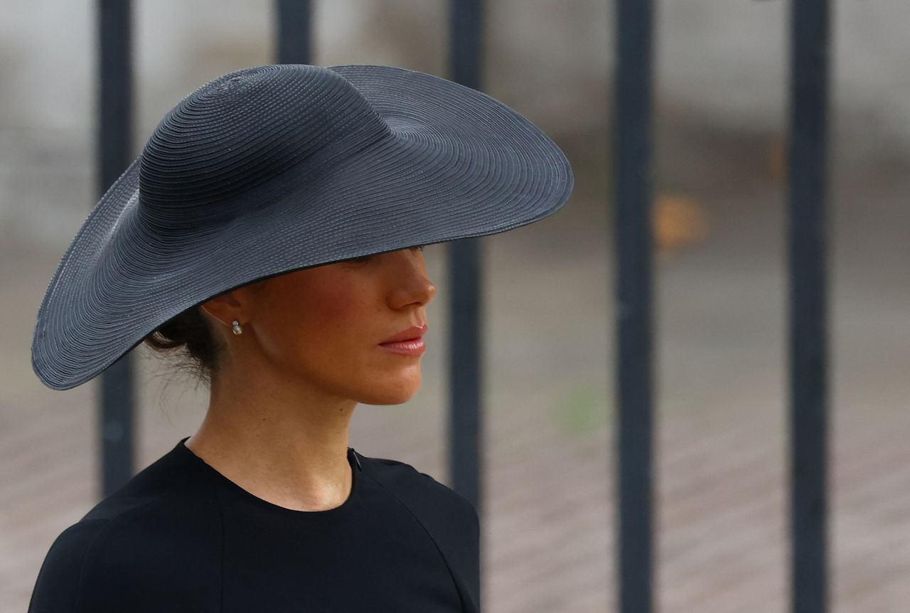 Meghan, the Duchess of Sussex, walks outside Westminster Abbey.