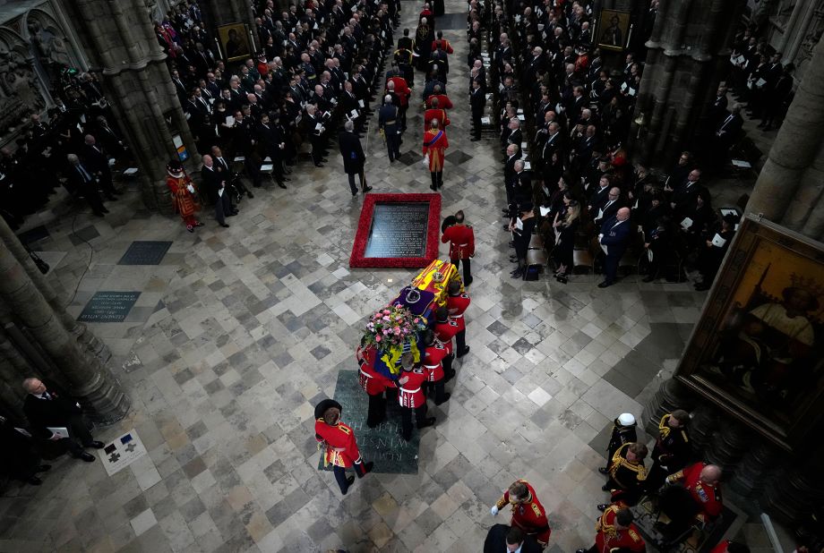 The coffin is carried into Westminster Abbey.