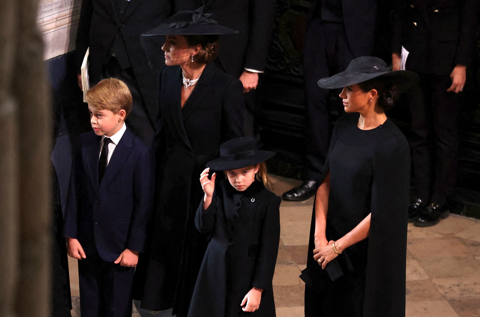 From left, Catherine, the Princess of Wales, and Meghan, the Duchess of Sussex, arrive at Westminster Abbey with Catherine's children Prince George and Princess Charlotte.