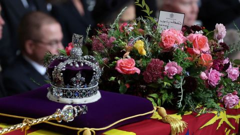 The Queen's coffin is carried into Westminster Abbey.