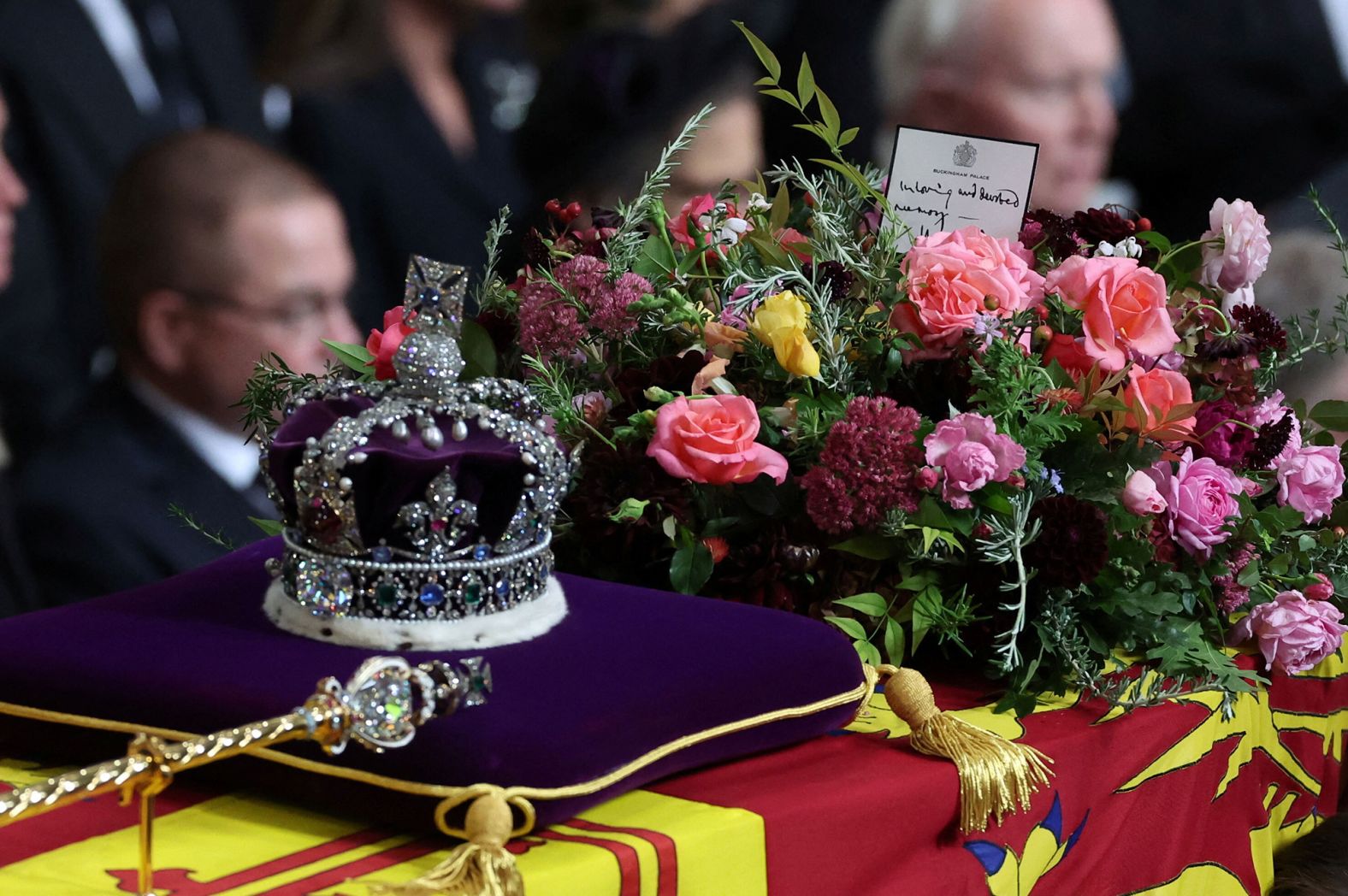 <a href="https://www.cnn.com/2022/09/19/europe/queen-funeral-coffin-note-charles-gbr-intl-scli/index.html" target="_blank">A handwritten card</a> placed on top of the Queen's coffin reads, "In loving and devoted memory. Charles R." The "R" in King Charles' title refers to "Rex," which is Latin for king.
