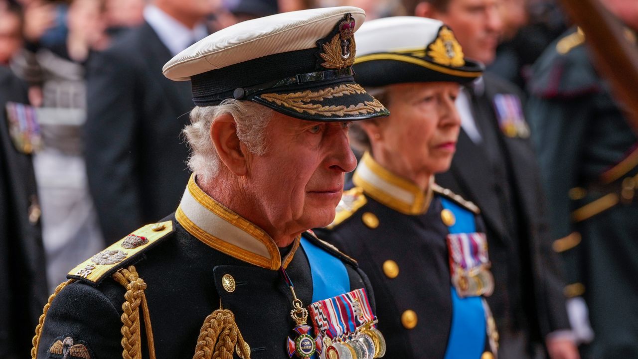 Britain's King Charles III, front, Anne, Princess Royal, right, and Prince William, background left, follow the coffin of Queen Elizabeth II as it is carried following her funeral service in Westminster Abbey in central London, Monday, Sept. 19, 2022. The Queen, who died aged 96 on Sept. 8, will be buried at Windsor alongside her late husband, Prince Philip, who died last year. (AP Photo/Andreea Alexandru, Pool)