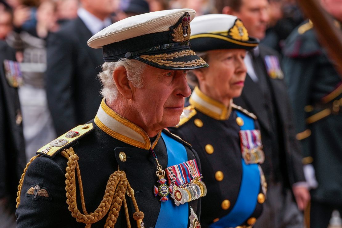 Britain's King Charles III, front, and Anne, Princess Royal, right, walk behind the Queen's coffin.