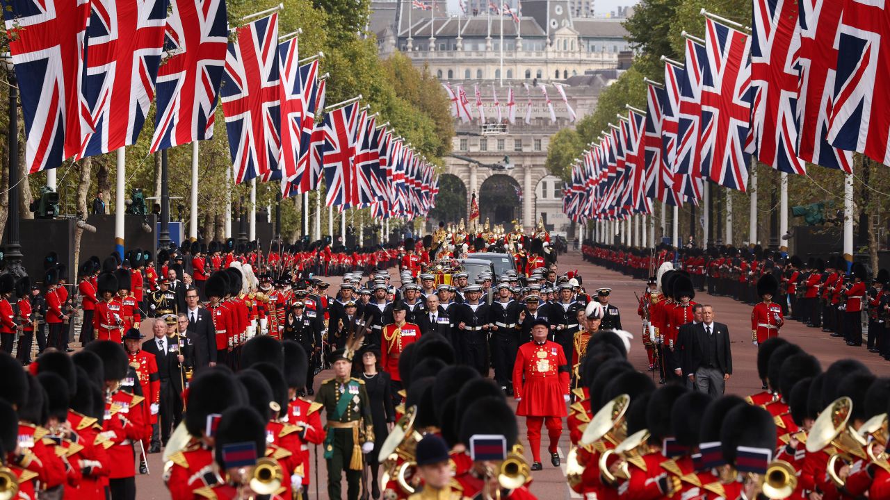 A royal cavalcade carries the Queen's coffin to Wellington Arch after her service at Westminster Abbey.