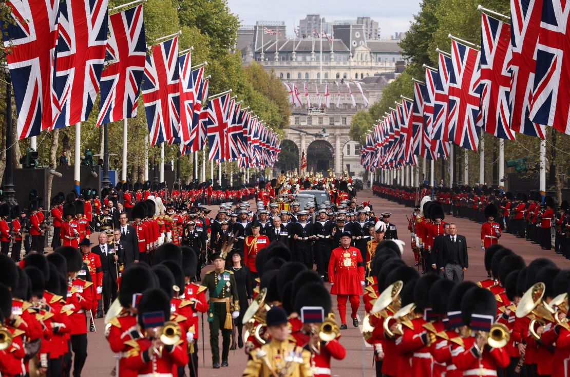 A royal cavalcade carries the Queen's coffin to Wellington Arch after her service at Westminster Abbey.