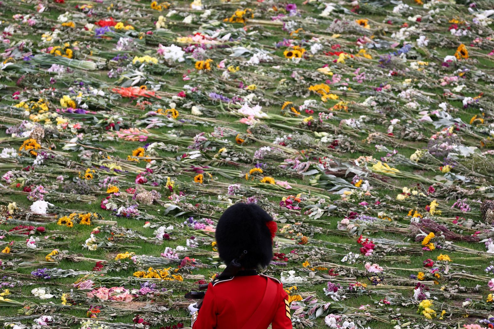 Floral tributes are seen at Windsor Castle on Monday.