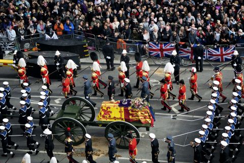A gun carriage transports the Queen's coffin after her funeral service at Westminster Abbey.