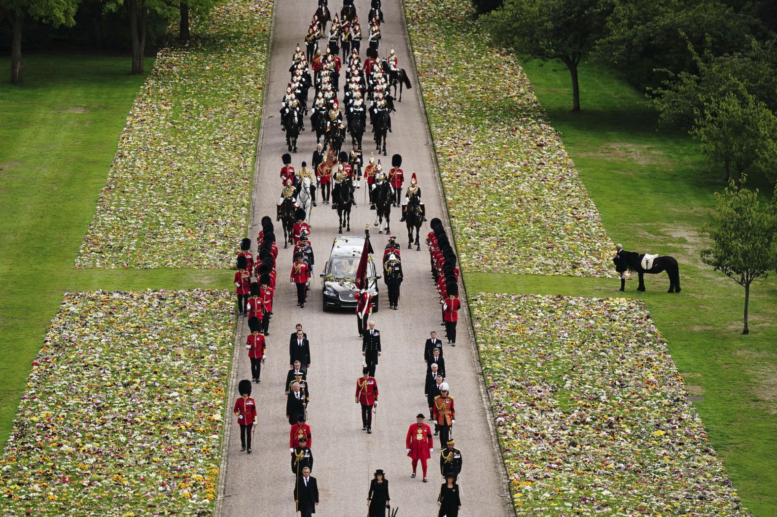 Emma, the Queen's fell pony, stands as the procession passes by at Windsor Castle.