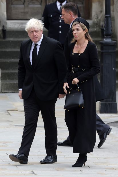 Former Prime Minister Boris Johnson and his wife Carrie Johnson arrive at Westminster Abbey.