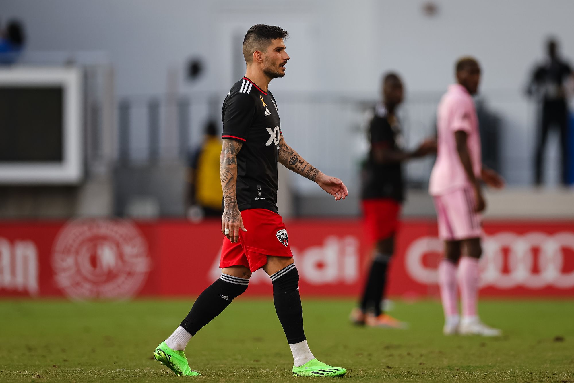 WASHINGTON, DC - MARCH 25: DC United midfielder Taxiarchis Taxi Fountas  (11) reacts while wearing the D.C. United Cherry Blossom Kit Jersey during  the New England Revolution versus D.C. United Major League