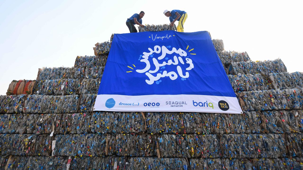 Environmental volunteers build a pyramid made of plastic waste collected from the Nile river, as part of an event to raise awareness on pollution on "World Cleanup Day" in Egypt's area of Giza near the capital, Cairo, on Saturday. 