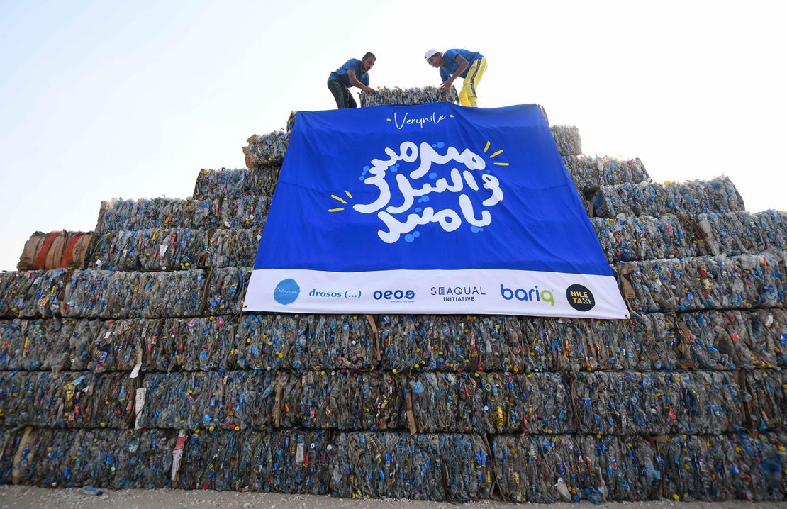 Environmental volunteers build a pyramid made of plastic waste collected from the Nile river, as part of an event to raise awareness on pollution on "World Cleanup Day" in Egypt's area of Giza near the capital, Cairo, on Saturday. 