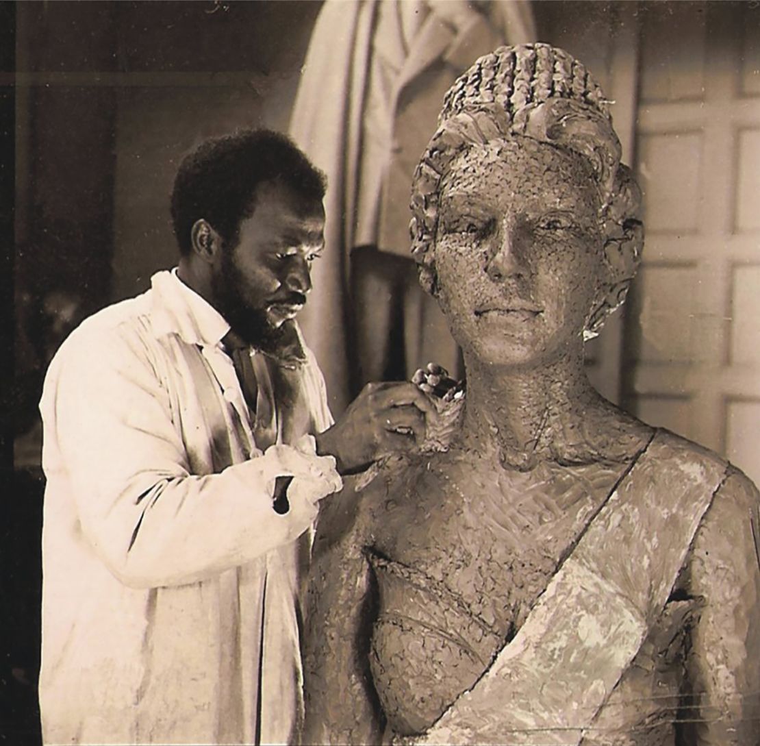 Ben Enwonwu working on the bronze sculpture of the queen