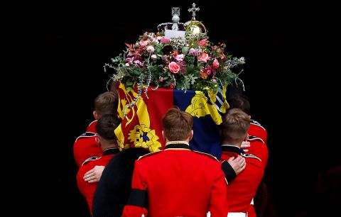 Pallbearers carry the Queen's coffin into St. George's Chapel.