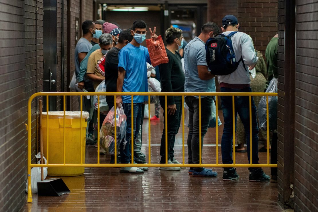 Migrants transported from Texas arrive at a bus terminal in New York City on August 25, 2022.  