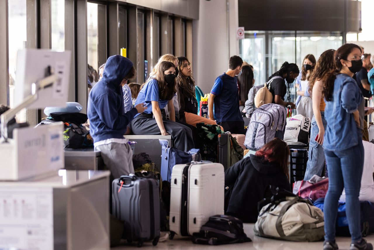 Travelers wait at Newark Liberty International Airport on July 1, 2022. The airport was plagued with cancellations and delays this summer.