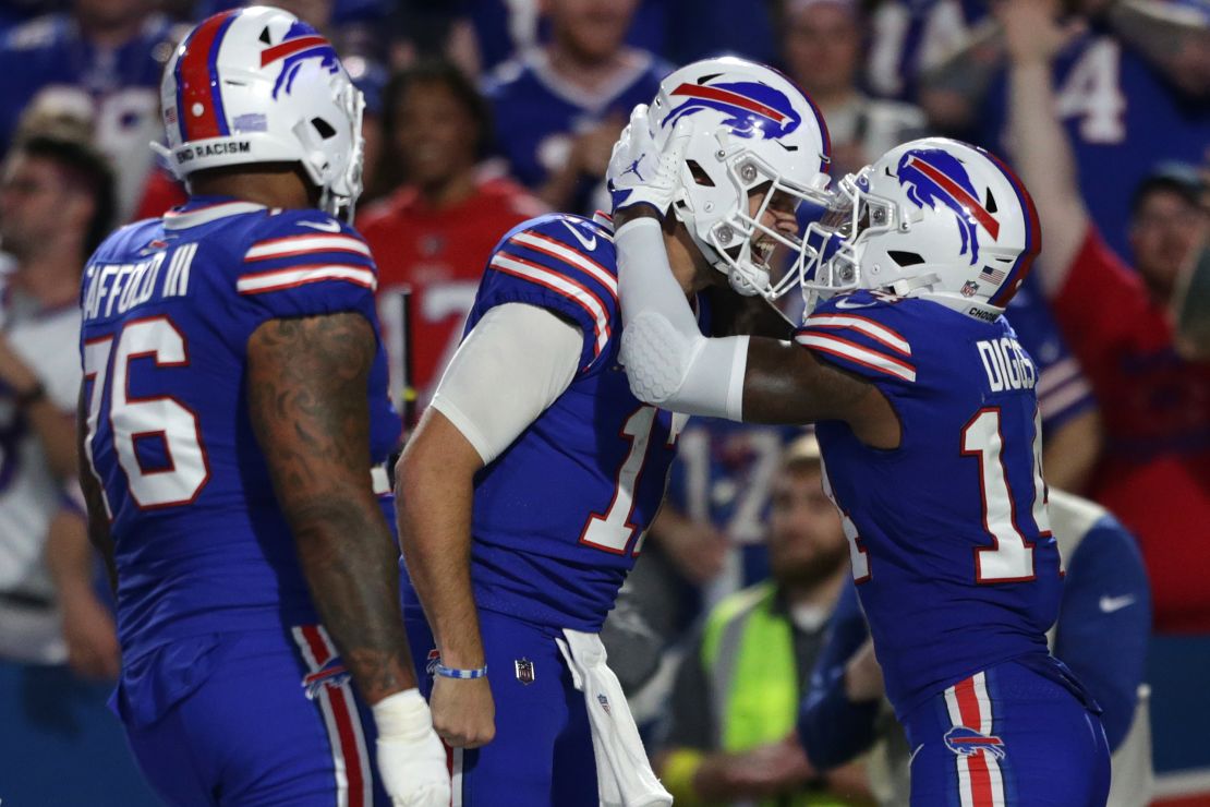 Stefon Diggs (14) of the Buffalo Bills celebrates with teammate Josh Allen (17) after scoring a touchdown against the Tennessee Titans on September 19, 2022.